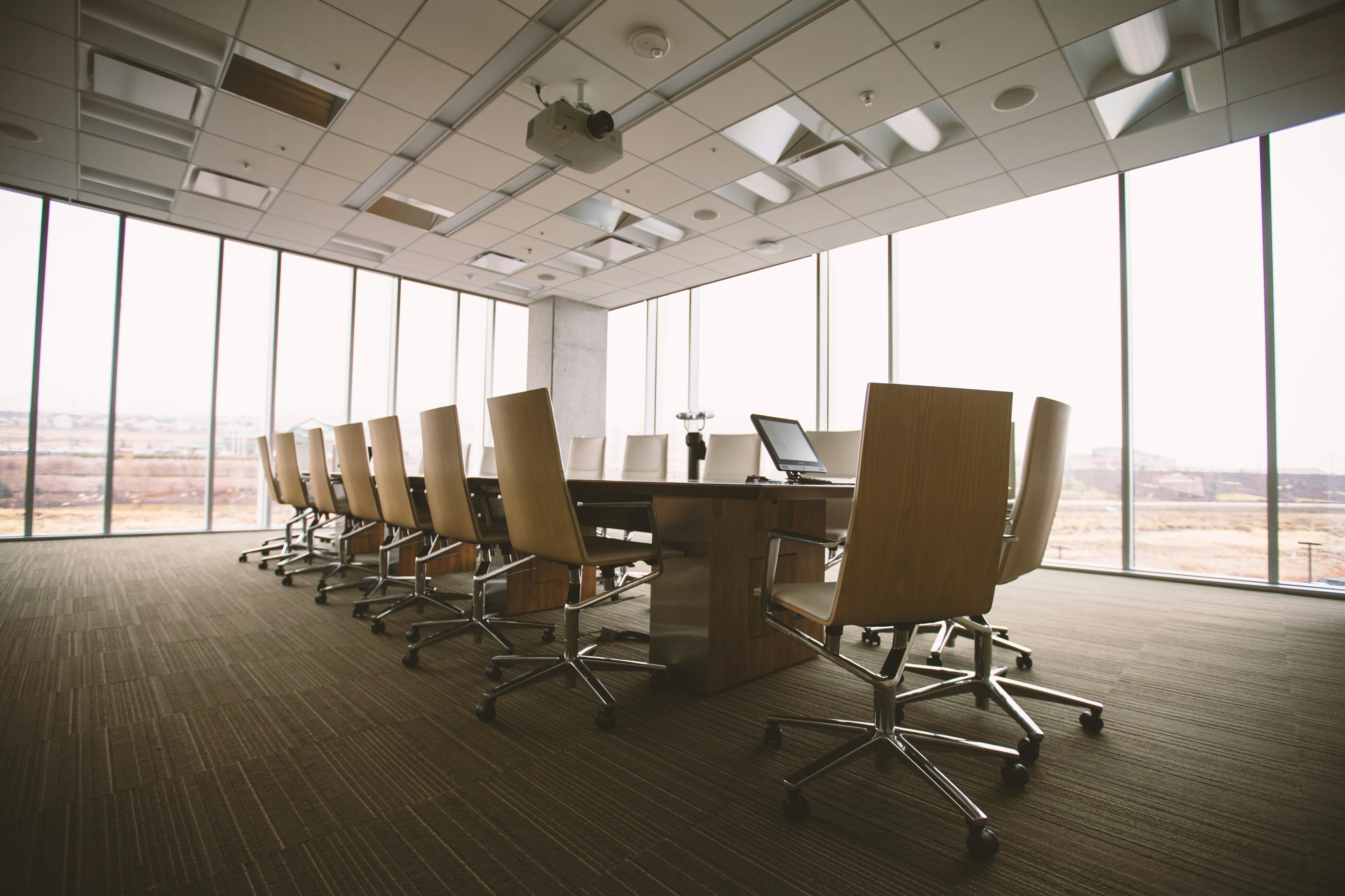 conference table with chairs and glass window view